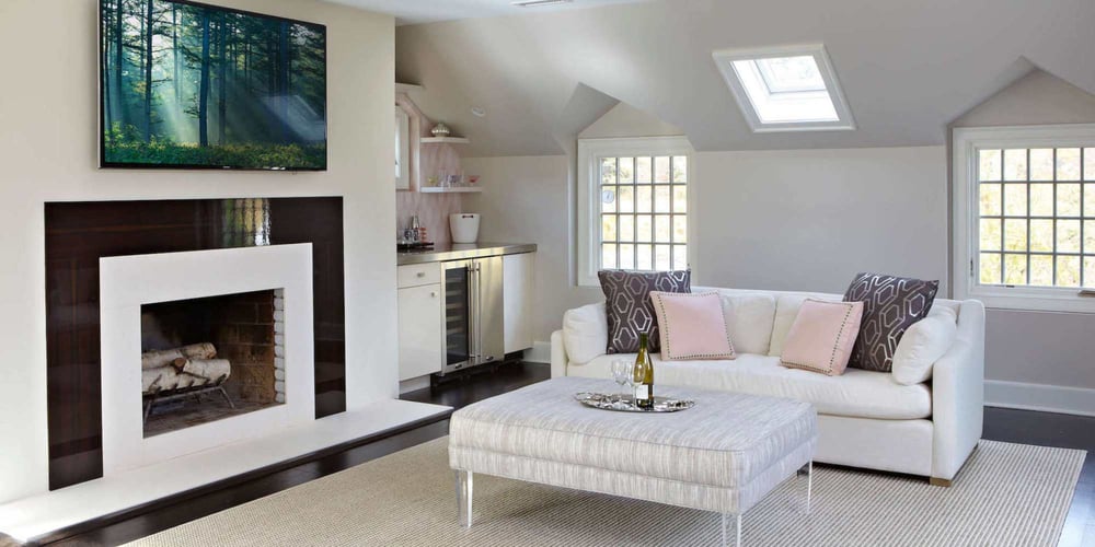 Image of a remodel second-story sitting area with fireplace and mini-bar by TR Design Build in New Canaan, CT