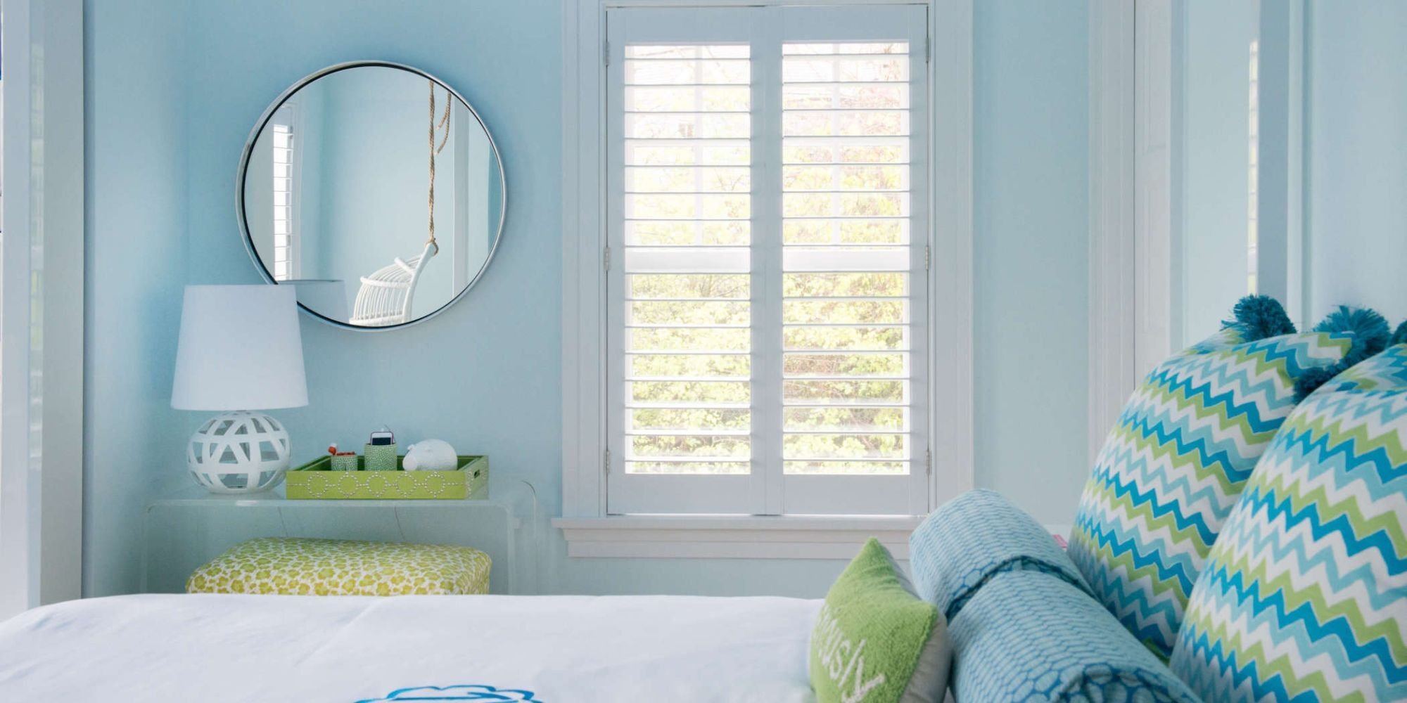 A Westport, CT bedroom remodel full of natural light and soft blue walls by TR Design-Build