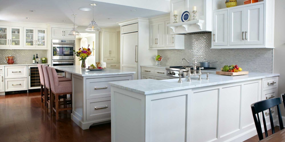 Custom home kitchen in New Canaan, CT by TR Design Build with dual islands, stainless appliances, and open layout