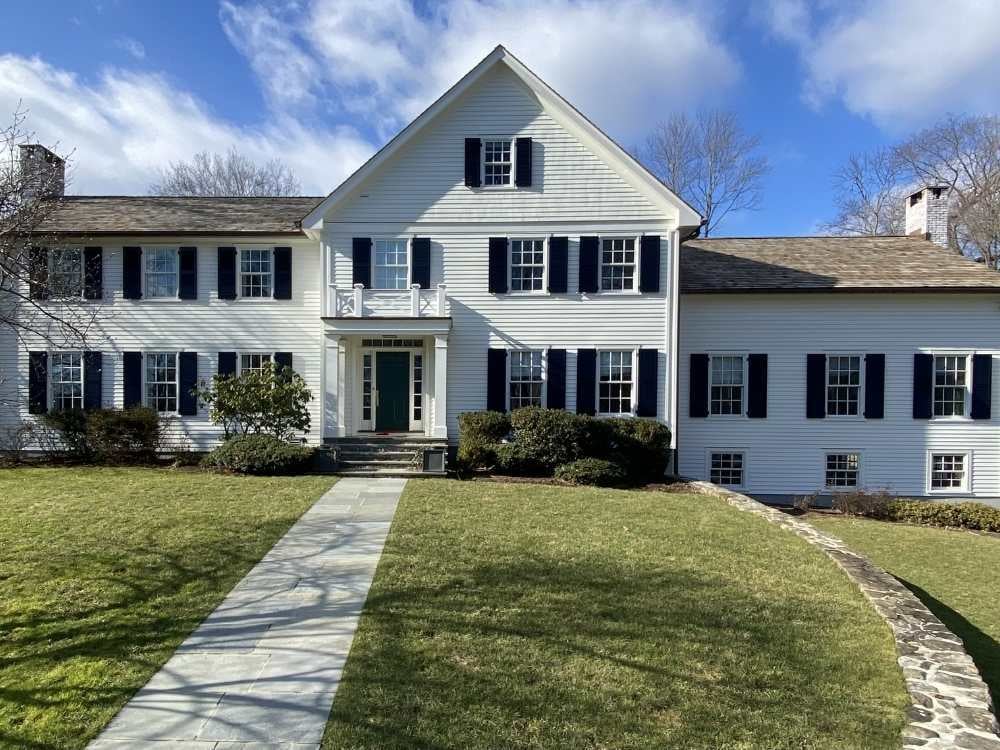 Image of the exterior of a two-story whole home remodel in Wilton, CT by TR Design Build