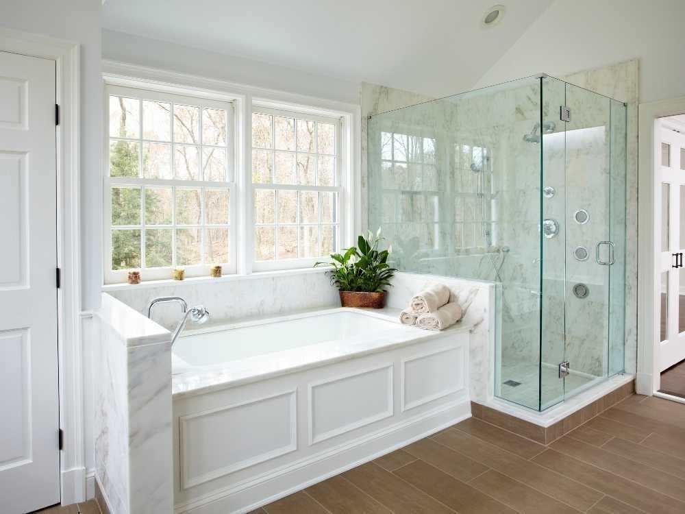 A bathroom remodel in Fairfield, CT whole home remodel with a soaking tub and glass shower by TR Design-Build