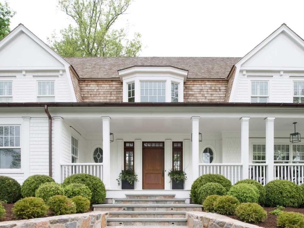 A custom home with a large covered front porch by TR Design-Build A custom home with a large covered front porch by TR Design-Build