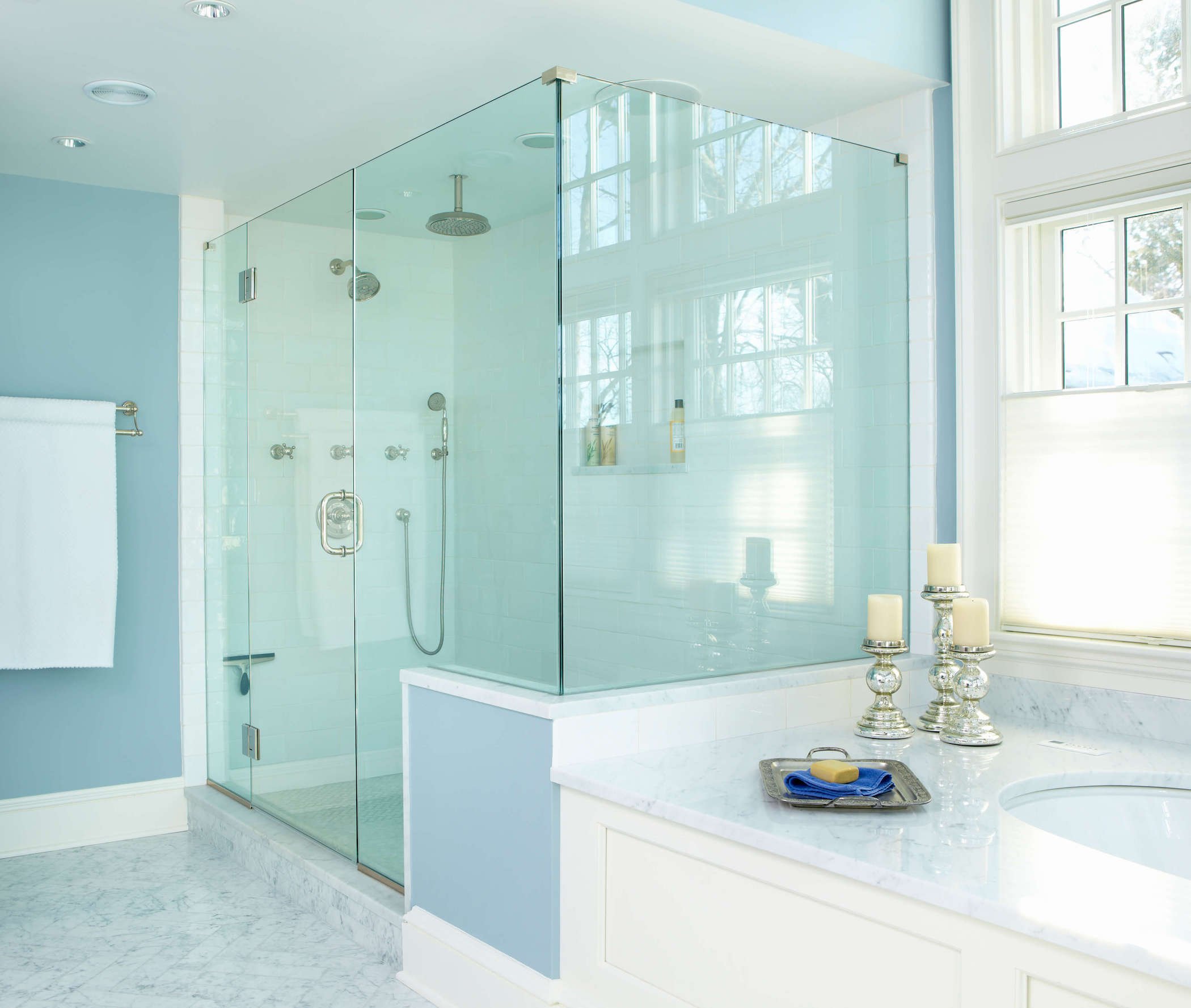 Luxury primary bathroom remodel featuring an oversized glass shower and soaking tub by TR Design-Build in Fairfield County, CT