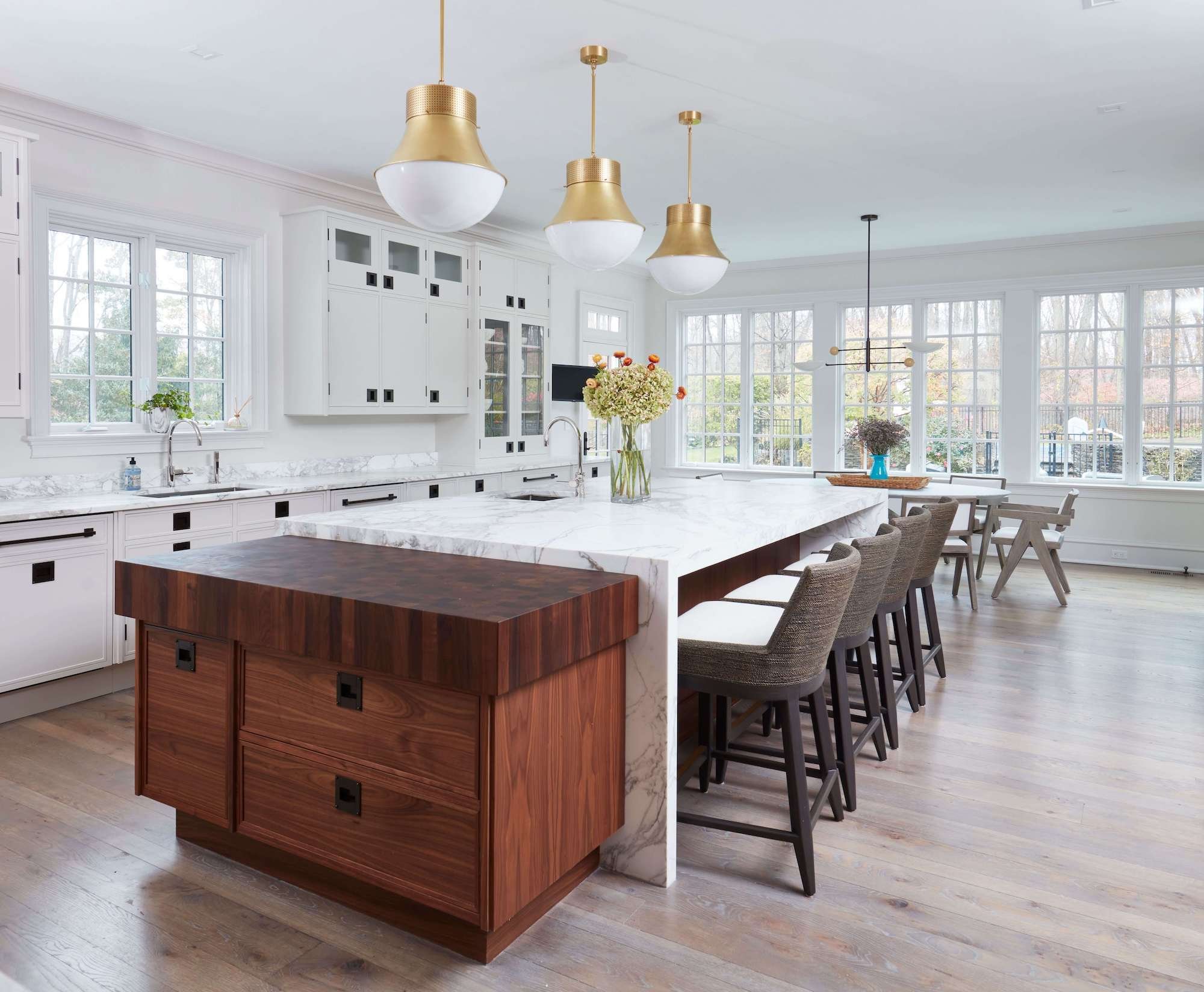 Custom kitchen remodel with a large seating island and large windows by TR Design-Build in Fairfield County, CT