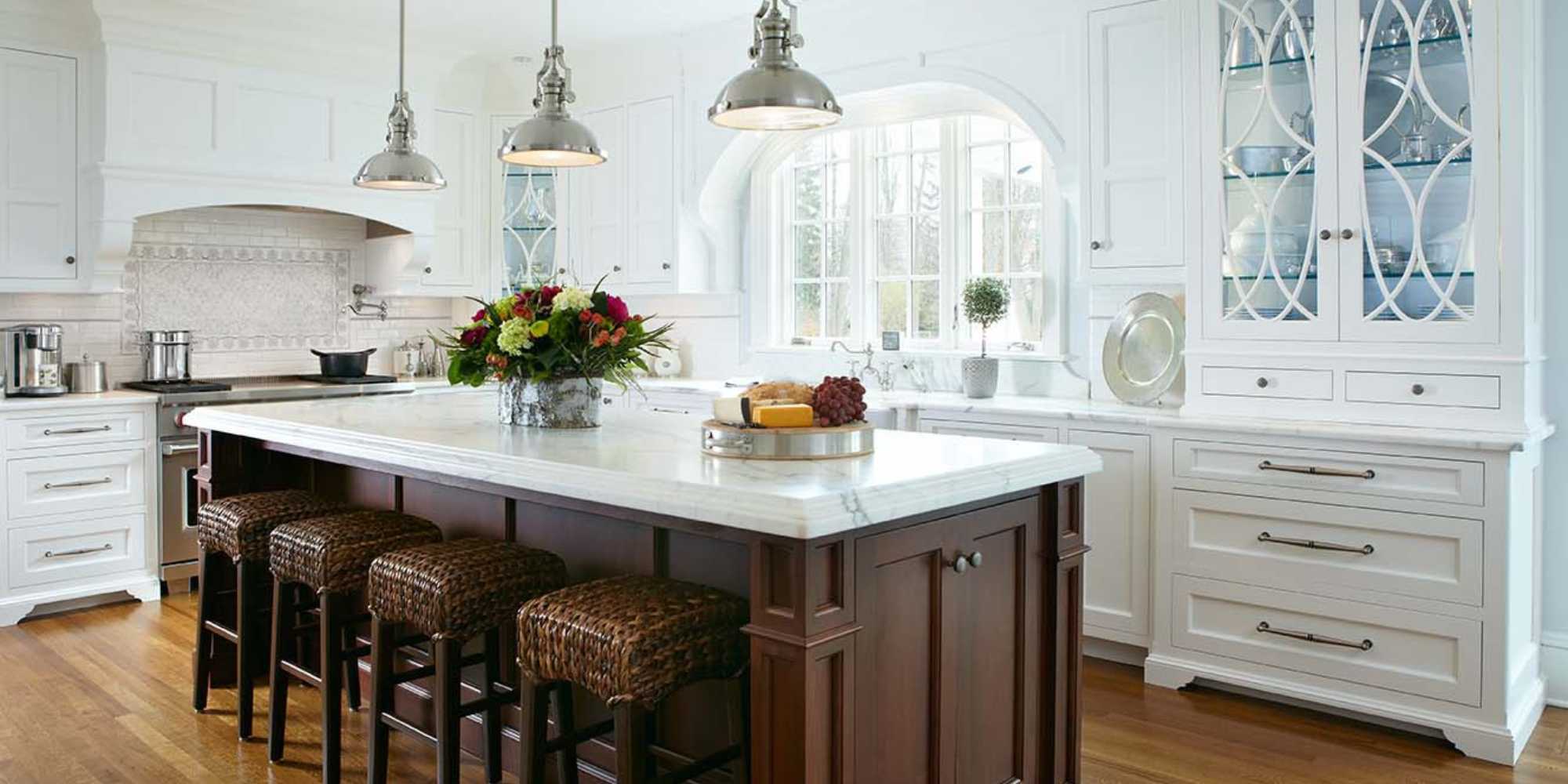 Remodeled kitchen with large island and custom cabinetry by TR Design Build in New Canaan, CT