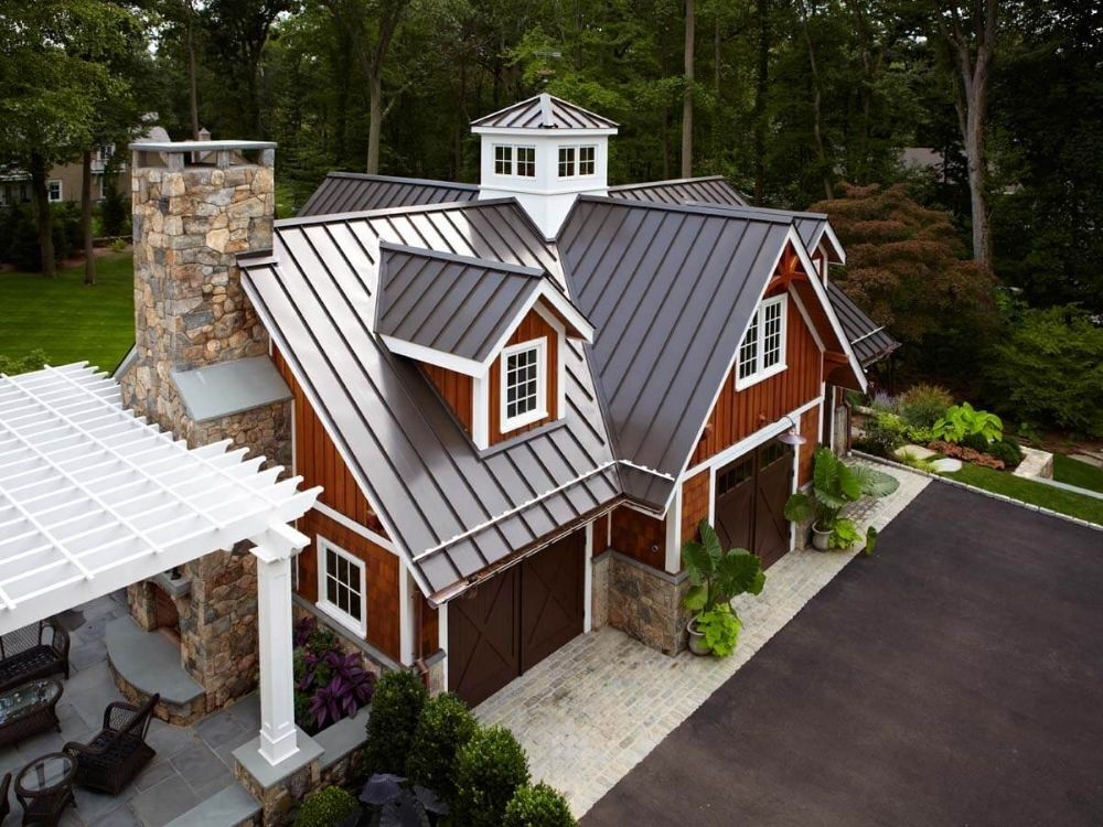 Custom detached garage with metal roof by TR Design Build in Darien, CT