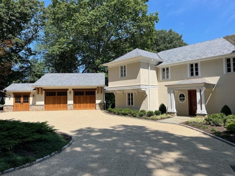 Custom home with covered front entry and two-story layout in Darien, Connecticut