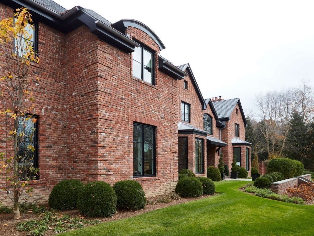 Luxury Darien residence featuring traditional architecture and curved dormers