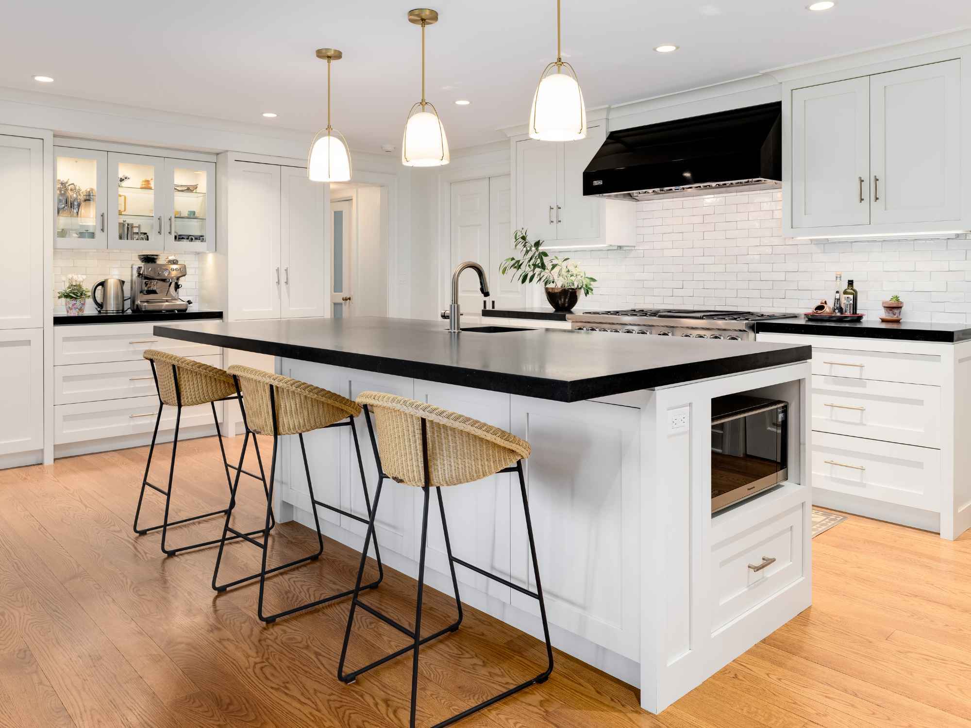 Custom kitchen remodel in New Canaan, CT featuring a sink island with seating and built-in appliance storage by TR Design-Build Custom kitchen remodel in New Canaan, CT featuring a sink island with seating and built-in appliance storage by TR Design-Build
